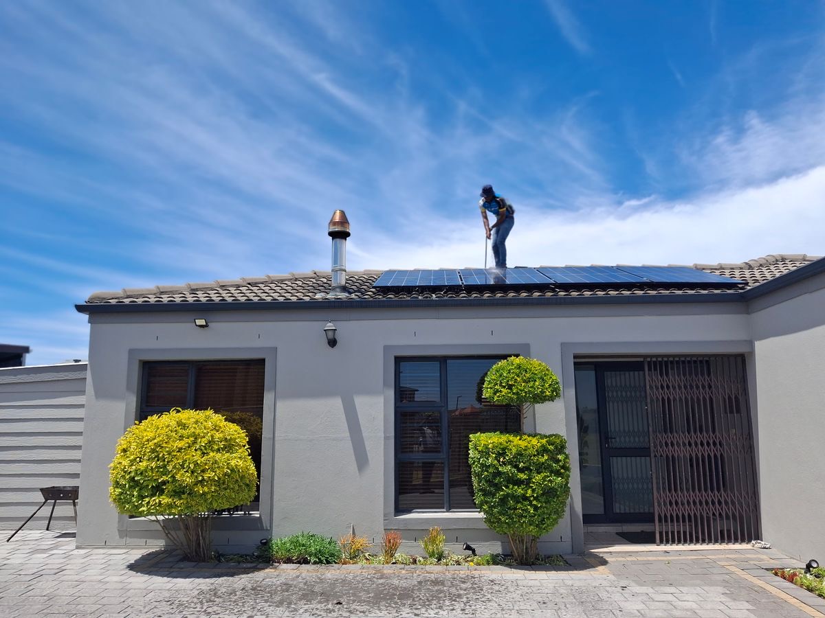 Solar panels being installed on a family home